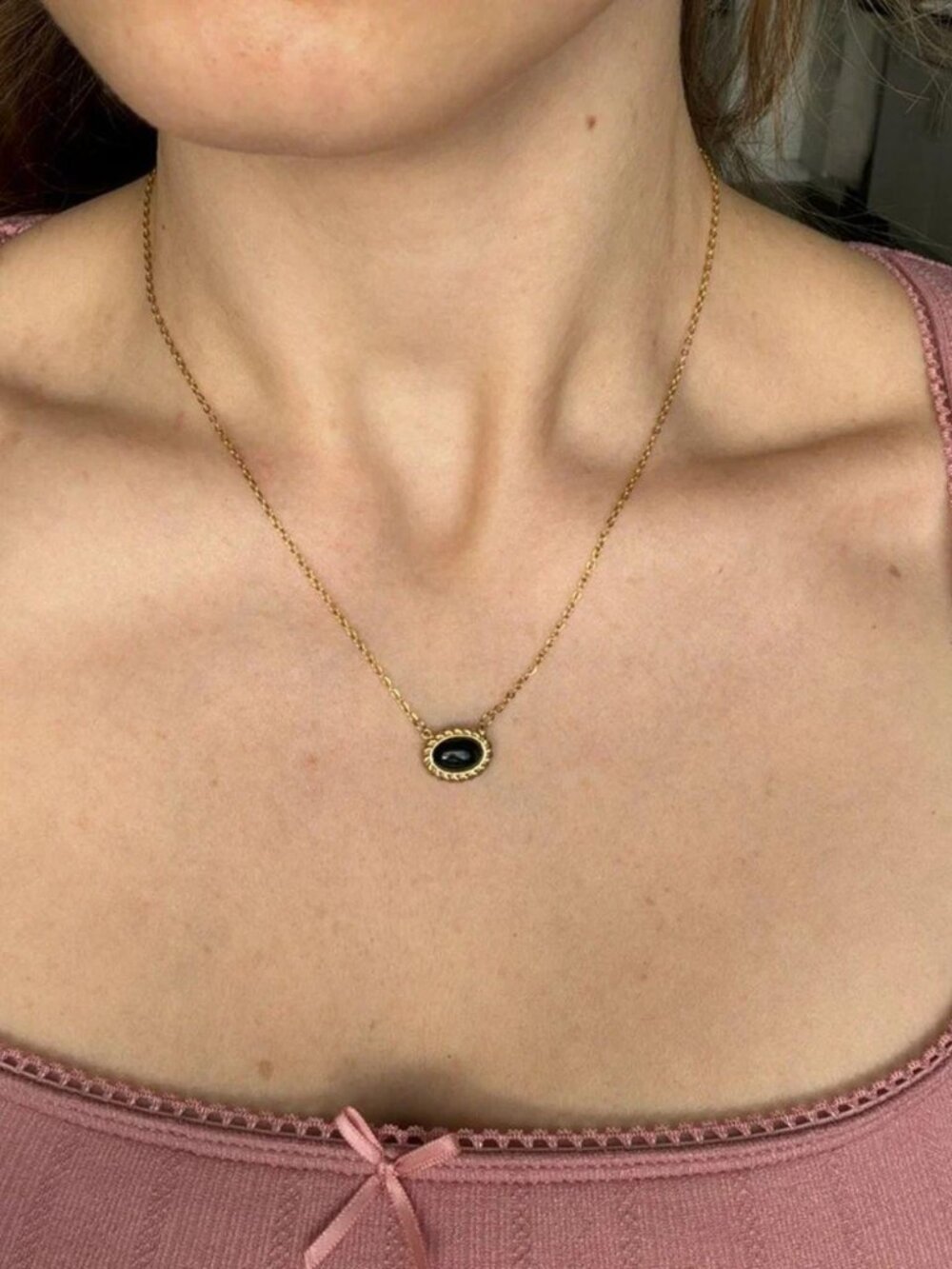 The Beth gold necklace with black stone and twisted braiding detail